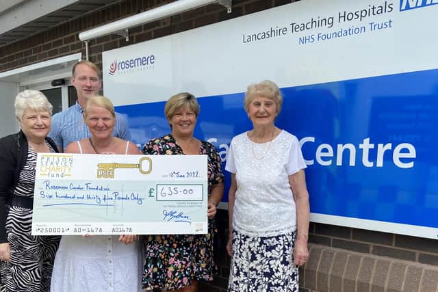 Dan Hill, chief officer of Rosemere Cancer Foundation, receives a cheque from (left to right) Chorley area’s Denise Bolton, Susan Higgins, Hazel Derbyshire and Marion Hilton, who took part in this year’s Walk in the Dark in memory of Marion’s late husband Harry, a former cancer centre patient