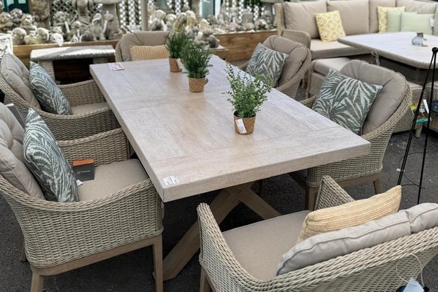 A gorgeous outside dining table and chairs set.
