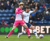Preston North End's Greg Cunningham battles with Huddersfield Town's Jack Rudoni