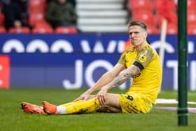 Preston North End's Emil Riis awaits treatment after the incident that damaged his ACL. (Image: Camera Sport) 