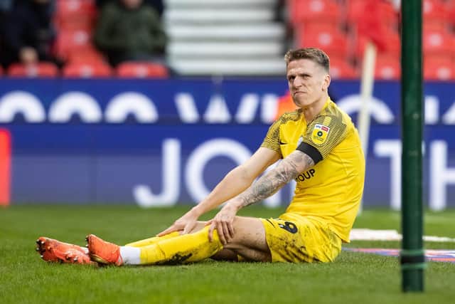 Preston North End's Emil Riis awaits treatment after the incident that damaged his ACL
