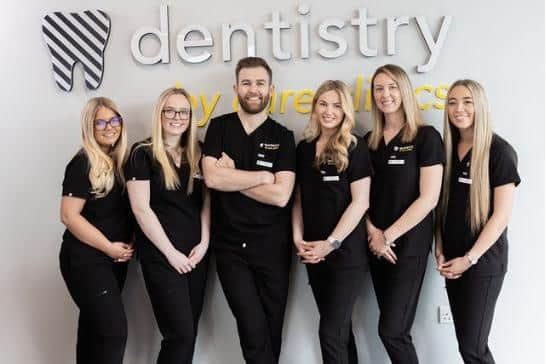 Dr Chris Ball with some of the staff at Dentistry by Cure Clinics.