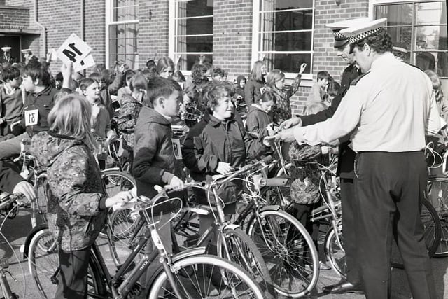 Penwortham children swept the board at the rally for young cyclists from the Longton and Penwortham areas. Here policemen talk to some of the competitors at the rally