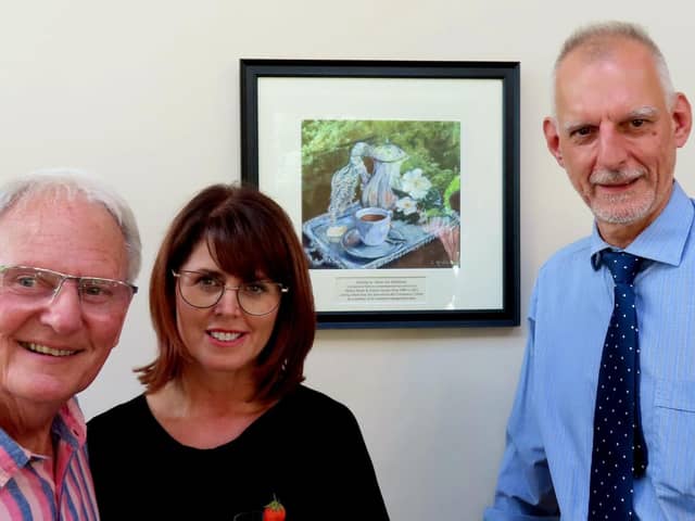 Brian and daughter Paula Middlemas with Seamus Heffernan (right) at Mellor Brook Community Centre