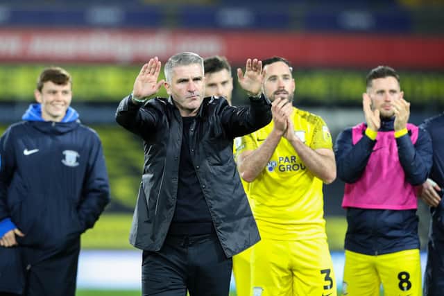 Preston North End manager Ryan Lowe applauds the fans.