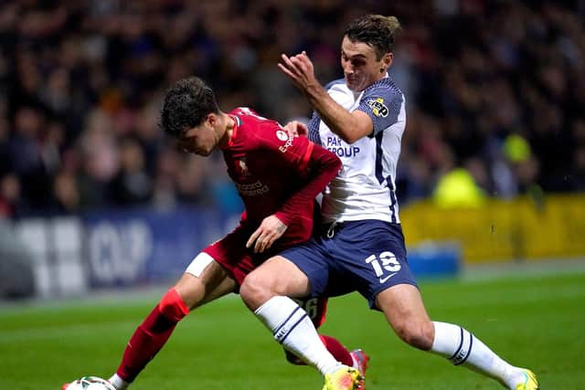 Preston North End midfielder Ryan Ledson challenges Liverpool's Neco Williams in the Carabao Cup at Deepdale