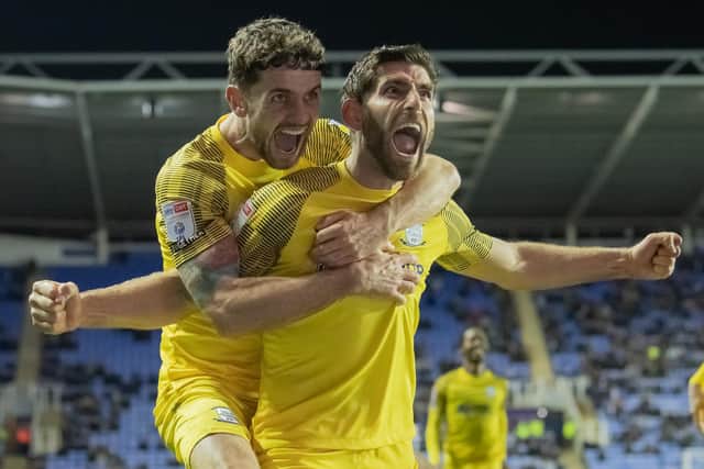 Preston North End's Ched Evans celebrates scoring his side's first goal against Reading with Robbie Brady