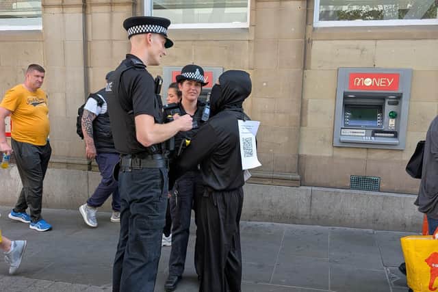 Rob is spoken to by police.