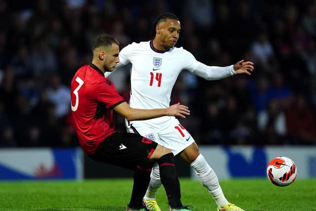 England striker Cameron Archer and Albania's Mario Mitaj battle for the ball during the UEFA European U21 Championship qualifying match at Chesterfield.