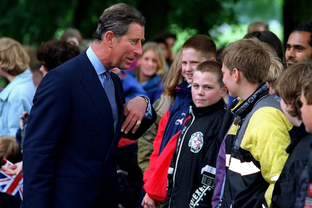 Prince Charles meets pupils during his visit to Moor Park High School in Preston