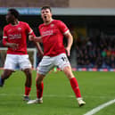 Chris Stokes celebrates his equaliser for Morecambe at AFC Wimbledon Picture: Andrew Redington/Getty Images