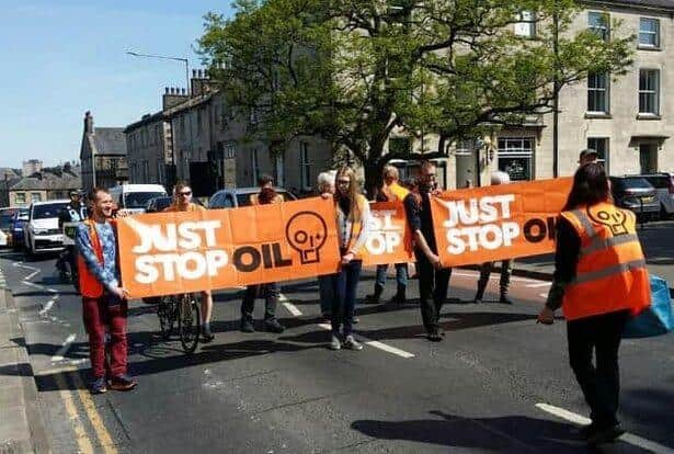 Just Stop Oil on a slow march on the streets of Lancaster in May