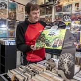 Steve Mathie owner of Spin It Records with a very rare copy of Heavy Petting by Dr Strangely Strange, at his store, the country's oldest vinyl shop which is celebrating its 30th anniversary of being in Trinity Market in Hull photographed by Tony Johnson for The Yorkshire Post. 29th March 2024