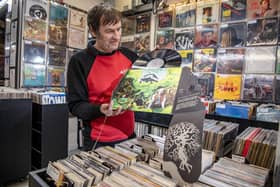 Steve Mathie owner of Spin It Records with a very rare copy of Heavy Petting by Dr Strangely Strange, at his store, the country's oldest vinyl shop which is celebrating its 30th anniversary of being in Trinity Market in Hull photographed by Tony Johnson for The Yorkshire Post. 29th March 2024