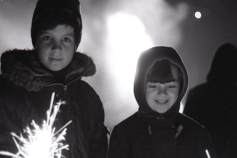 John McLellan and Pamela Booth, both aged 10, enjoy the fun of a bonfire night at Preston Amounderness Round Table's bonfire at Lytham Road, Fulwood