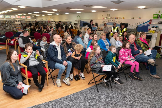 Audience members listen in as children's author R.K. Alker tells one of his stories at Chorley Library