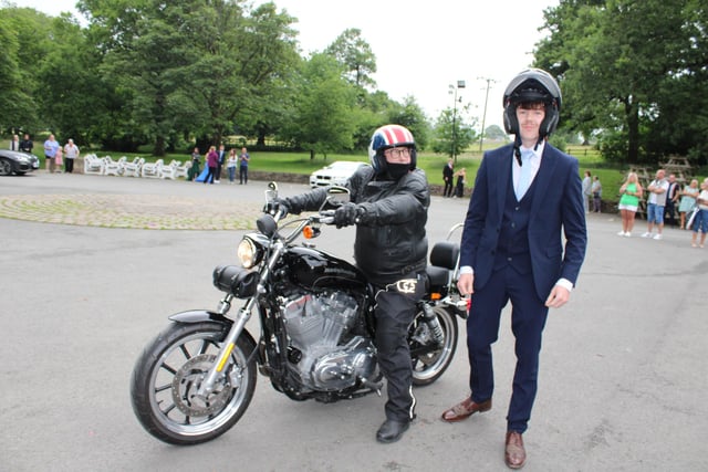 A Lostock Hall Academy pupil arrives on a motorbike