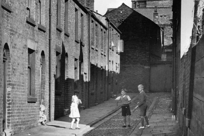 Park Court, Preston c.1950
Viewed looking north towards Fishergate. Park Court was located just east of New Cock Yard, sandwiched between Glovers Court and Cannon Street. The homes seen here were swept away in the late 50's as part of the town's re-housing scheme. A plan that was partly designed to reduce the population density of the town centre.