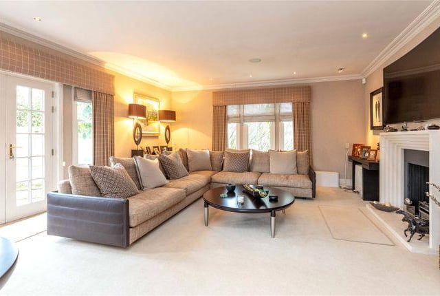 A large, light and airy livingroom with the grandest fire place in the house. It's huge.
