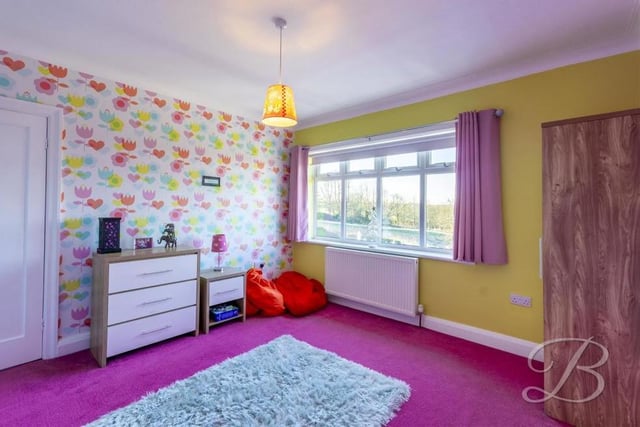 All four bedrooms are spacious and boast lovely views from large windows. This one overlooks the back garden.