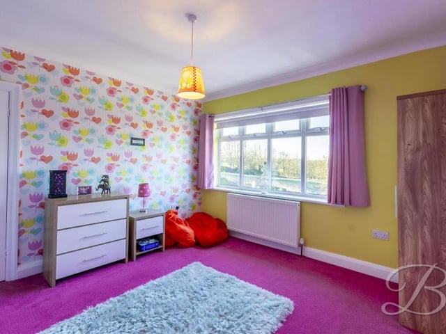 All four bedrooms are spacious and boast lovely views from large windows. This one overlooks the back garden.