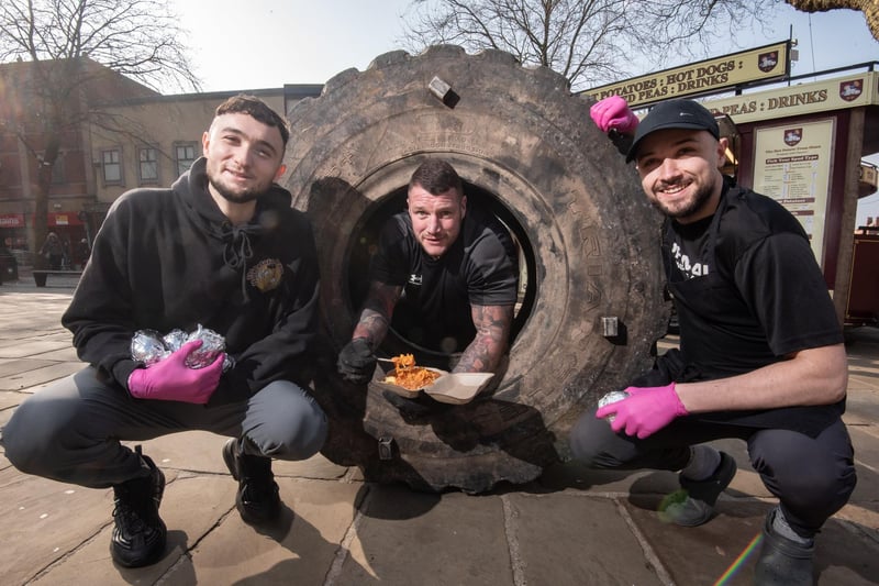 Bill Hodgson (centre) completed a 24-hour tyre roll in Preston's Flag Market last weekend, with the Spud Brothers aka Harley (left) and Jacob (right) supporting him with a spudathon.