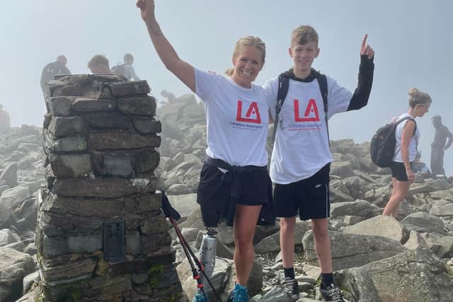 Lianne and her son posing on Scafell Pike like they did on Snowdon, Lianne said: "We cant wait to get that 3rd one."
