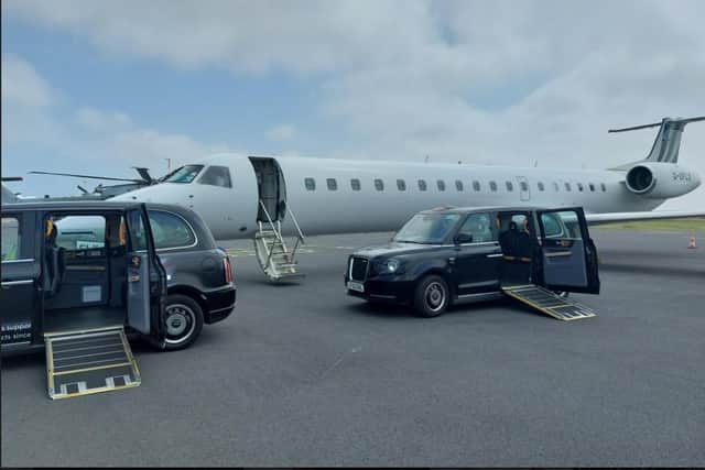 Two black cabs greet the BAE private jet with its two VIP veterans onboard.