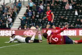 Liam Lindsay brings down Tom Lawrence and is sent off for the foul.