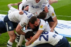 Preston North End's Brad Potts is mobbed after scoring the winner.