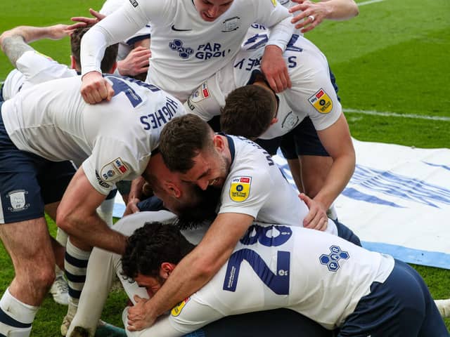 Preston North End's Brad Potts is mobbed after scoring the winner.