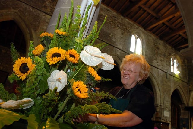 Audrey Mennie working on a flower arrangement in preparation for the bank holiday weekend flower festival in 2005