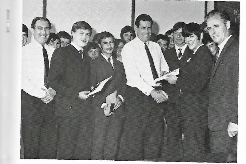 General manager Mr R S Smith (centre, white shirt) was presenting Duke of Edinburgh silver awards. Amateur football goalkeeper Derek Lilley can also be seen, behind Mr Smith. 1969