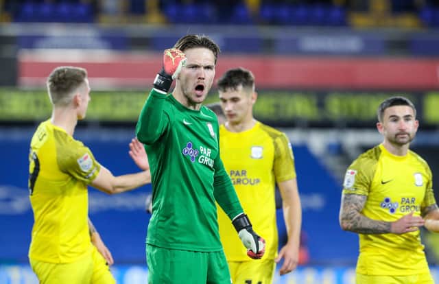 Preston North End's Freddie Woodman celebrates after the match against Huddersfield Town
