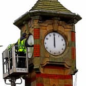 A worker removes the clock faces from Morecambe Clock Tower so they can be repaired by clock specialists. Picture by Tony North.