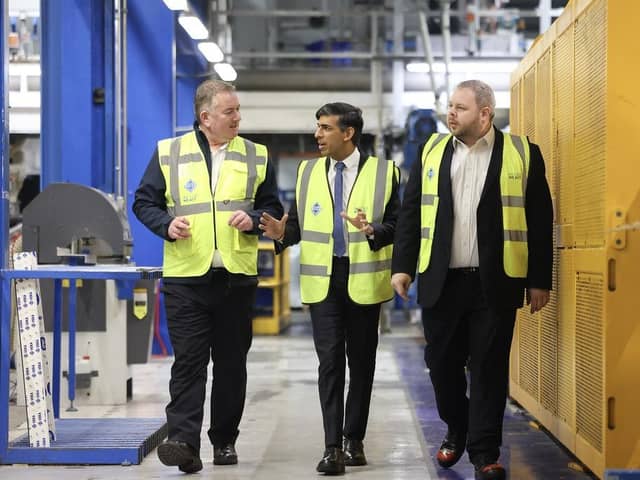 Prime Minister RIshi Sunak flanked by managing director Neil Evans and MP Antony Higginbotham during a visit to VEKA today