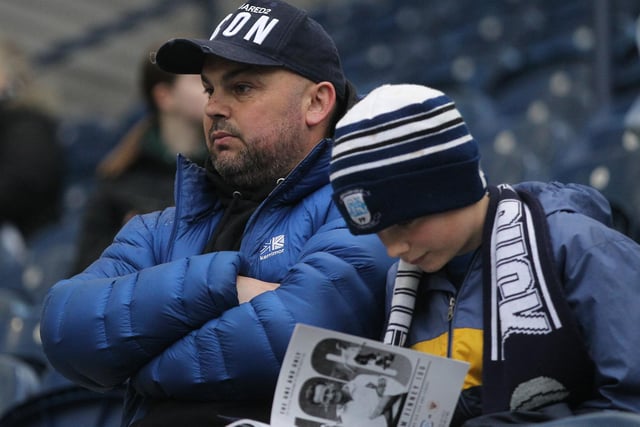 This young PNE fan reads the official matchday programme before the Blackpool game