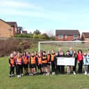 Pupils at the Redeemer School welcoming the cheque for £6,000