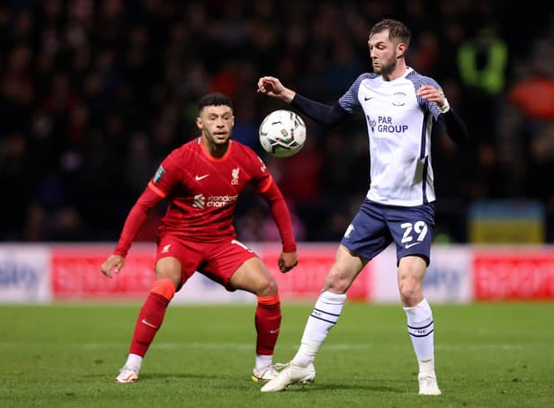 PRESTON, ENGLAND - OCTOBER 27: Alex Oxlade-Chamberlain of Liverpool looks on as Tom Barkhuizen of Preston North End controls the ball during the Carabao Cup Round of 16 match between Preston North End and Liverpool at Deepdale on October 27, 2021 in Preston, England. (Photo by Naomi Baker/Getty Images)