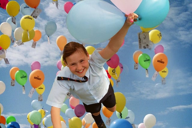 Up, up and away... Archbishop Temple High School year 7 pupil Jade Kelly, 12, during the Great Balloon Race at the school in Fulwood, Preston