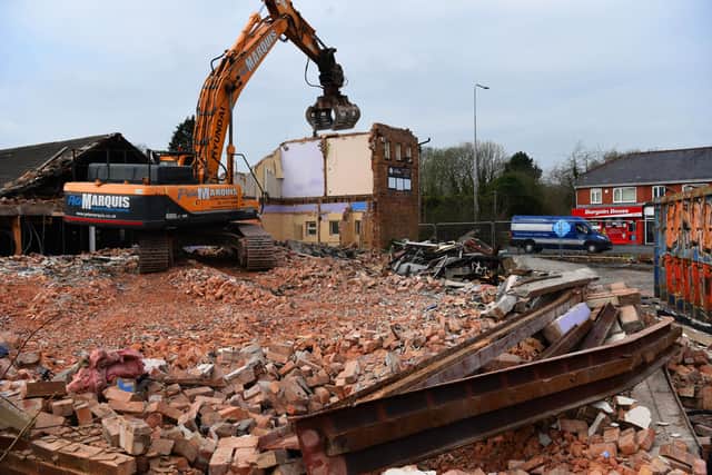 Going, going, almost gone  - photographer Neil Cross took this image of the former Shampan restaurant in Penwortham  being demolished