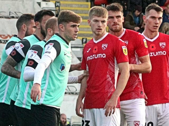 Liam Shaw (right) and Kieran Phillips (third right) impressed while on loan with Morecambe last season Picture: Michael Williamson