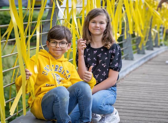 Claire and Rhys Guthrie at the Yellow Ribbon Day. Ribbons will remain on display throughout June and July.