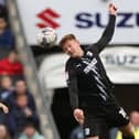 Morecambe new boy Ged Garner (right) featured against tomorrow's opponents, MK Dons, for Barrow AFC earlier in the season Picture: Pete Norton/Getty Images