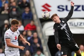 Morecambe new boy Ged Garner (right) featured against tomorrow's opponents, MK Dons, for Barrow AFC earlier in the season Picture: Pete Norton/Getty Images