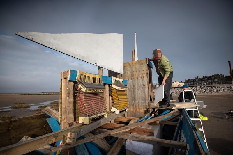 The boat being constructed before it was set on fire and sent out to sea.