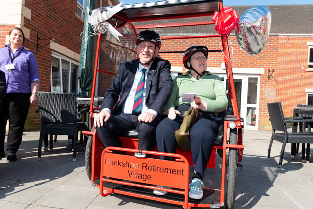 Sir Lindsay Hoyle and a resident are the first to try out the rickshaws at Buckshaw Retirement Village