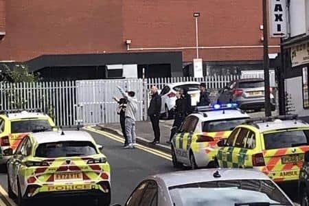 Emergency services near the scene in Guild Row, off Church Street in Preston, shortly before a young man fell from a 7-storey building on Sunday morning (August 6). (Picture by Somewhere in Preston)