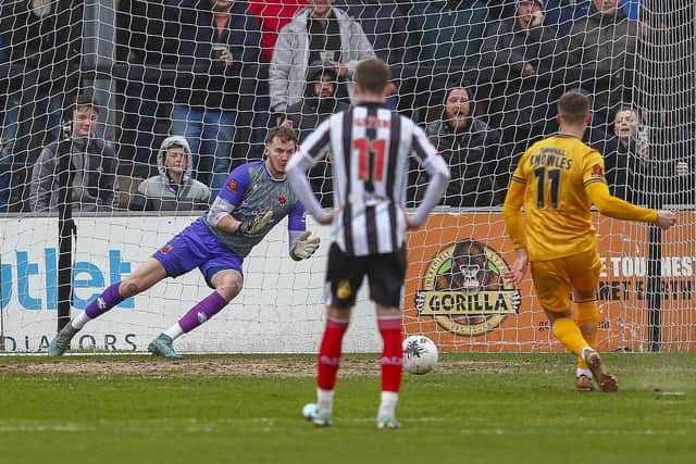 Boston United's Jimmy Knowles beats Chorley keeper Max Dearnley from the penalty spot (photo: David Airey)