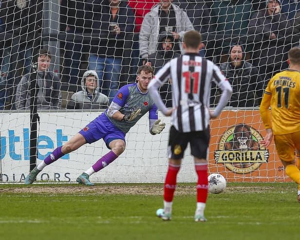 Boston United's Jimmy Knowles beats Chorley keeper Max Dearnley from the penalty spot (photo: David Airey)